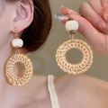 Detail of bohemian rattan woven hoop earrings with white knit balls and wooden beads - 65# Steel Pin-Coffee-Round