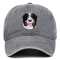 Close-up of detailed Bernese Mountain Dog embroidery on grey washed denim baseball cap - Gray