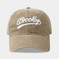 Close-up of khaki washed cotton baseball cap with white Brooklyn embroidery detail - Adjustable / Khaki
