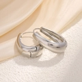 Minimalist silver chunky hoop earrings with drop shape and polished finish on sand - Teardrop Hoops / Silver