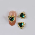 Golden alloy nail charms featuring green heart gems and rhinestones on a white background - Gold Metal Base Green Heart
