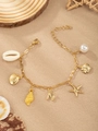 Ocean-themed gold bracelet with starfish, pearls, shells, and a letter N pendant - Letter N(N)