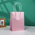 Pink glitter gift bag made of white kraft paper with sturdy white rope handles - Champagne