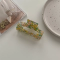 Detail of colorful mosaic acetate hair claw clip on a minimalist white background tray - Large Square Claw / Floral Yellow Green