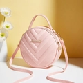 Pink round crossbody bag with V-quilted faux leather and golden metal accents - Pink