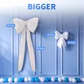 Confronto tra fiocchi bianchi decorativi grandi e piccoli per decorazioni murali di nozze - Fiocco Bianco Grande E Piccolo