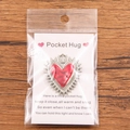 Red enamel pocket hug heart pendant with silver border on a greeting card package - Radiating Light Red Heart