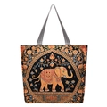Ethnic bohemian tote bag featuring golden elephant embroidery on black woven fabric - Running Golden Elephant