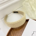 Detail of beige knit headband with handmade label on rustic wooden tray background - Knitted Wide Brim Style / Yellow