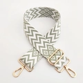 Detail of adjustable 5cm wide woven bag strap with green and beige geometric patterns - Matcha Green