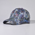 Detail of distressed denim baseball cap featuring vintage floral patterns and frayed edges - Adjustable / Guofeng Green