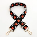 Adjustable wide knitted bag strap with orange star patterns and gold metal swivel clips - Black Base Orange Star Gold Buckle