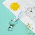 Iridescent laser PVC lanyard keychain with silver lobster clasp on mint background - Holographic White