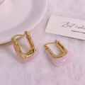 U-shaped gold plated earrings with pink resin inserts on a white plush background - 18K Gold / Light Pink