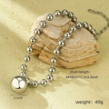 Macro detail of silver beaded necklace with a large 2.5cm polished metal ball pendant - Silver Round Ball