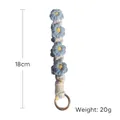 Handmade crochet daisy keychain in light blue and yellow, 18cm length with gold ring - Pale Blue & Yellow