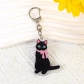 Cute black cat acrylic keychain with pink bow and green eyes on white background - Style 7 Little Black Cat [B262]