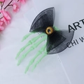Gothic Halloween hair clip with neon green skeleton hand, black mesh bow, and yellow eyeball - Butterfly One-eyed Hairpin - Green Skeleton Hand