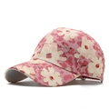 Close-up of pink baseball cap featuring beige flowers with gold sequins and leopard print - One Size / Pink