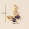 Detailed view of butterfly pendant with purple drop stone and dimensions 2.6cm by 2cm - Gold Purple Butterfly