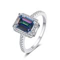 Detailed close-up of rainbow emerald-cut moissanite ring with small side diamonds - Rainbow