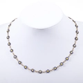 Detail of blue daisy flower pendant necklace with 18k gold plating and enamel inlay - Gold+Dark Blue