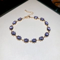 Elegant gold bracelet featuring oval purple cubic zirconia with adjustable lobster clasp - Gold-Blue
