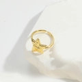Adjustable golden star-shaped open ring displayed on an aesthetic white stone pedestal - Large Star (JZ0521-2)