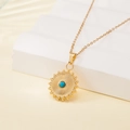 Gold stainless steel sunburst necklace featuring a central turquoise stone inlay - Sunray Round Turquoise Style (137604)