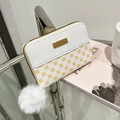 Elegant white faux leather mini purse with yellow floral patterns and white fur pompom - White