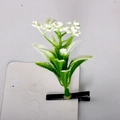 Macro detail of artificial sprout hair clip with small white flowers on black clip - Little Tree Style 1