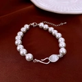 Detail of elegant pearl bracelet with silver clasp on a dark red silk background - White Pearl Bracelet with Silver Tone Clasp (16#)