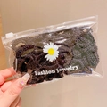 Élastiques à cheveux en dentelle noire dans une pochette transparente à marguerites - Lot de 50 / Noir