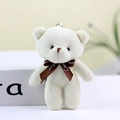 Cream teddy bear plush keychain with brown Love ribbon shown in a front view - White