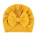 Detail of baby turban with large bow in ginger yellow ribbed elastic fabric - Yellow