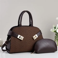 Detail of dark brown tote bag with bronze woven texture and gold metal buckles - Coffee