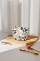 Detail of French vintage cotton linen cosmetic bag with floral embroidery and gold accents - Black Leaf Small