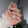 Dettaglio del bracciale con perline occhio di gatto, perle di giada verde e ciondolo in giada - Perla Verde (4# Bracciale-Perla Verde)