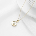 Gold chain necklace featuring a white mother of pearl round pendant with a small cross - Cross / Gold