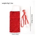 Detail of red sequin Christmas wine bottle cover with size 35x13cm and plush white fur trim - Red
