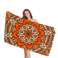 Bohemian mandala beach towel with orange and brown floral patterns shown by a model - Style 6