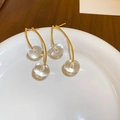 Close-up of golden cherry earrings with transparent beads on white ceramic tray - Gold Transparent Cherry (Silver Needle)