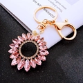 Sparkling pink crystal sunflower keychain with gold plating and white pearl detail - Pink