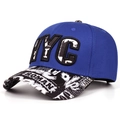 Detail of NYC patch embroidery and graffiti print on a flat brim hip-hop snapback hat - Blue