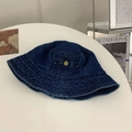 Detailed view of dark blue denim bucket hat with a small pocket and metal buckle detail - M / Blue