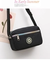 Lightweight black nylon crossbody bag with colorful zippers and sporty star logo detail - Black