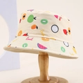 Close-up of children fruit print bucket hat with kiwi and strawberry canvas patterns - 54cm (3-8 Years) / Beige