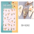Close-up of 5D Christmas nail stickers with embossed holly and gold foil textures - 5D-K282