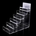 6-tier clear acrylic tiered display stand for wallets and phones with a black background - 6-Tier / Clear