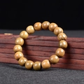 Bracelet en perles de bois brun artisanal avec grain naturel sur boîte en bois - Perles Classiques en Bois de Santal Vert / 12mm*17 Perles